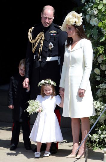WINDSOR, UNITED KINGDOM - MAY 19:  Prince William, Duke of Cambridge and Catherine, Duchess of Cambridge with Prince George and Princess Charlotte leave St George's Chapel, Windsor Castle after the wedding of Prince Harry, Duke of Sussex and the Duchess of Sussex on May 19, 2018 in Windsor, England. (Photo by Andrew Matthews - WPA Pool/Getty Images)