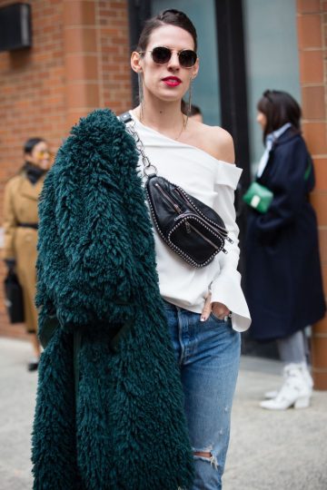 NEW YORK, NY - FEBRUARY 10: A guest poses outside of the Tibi show wearing a jacket, white shirt and blue jeans during New York Fashion Week on February 10, 2019 in New York City. (Photo by Donell Woodson/Getty Images)